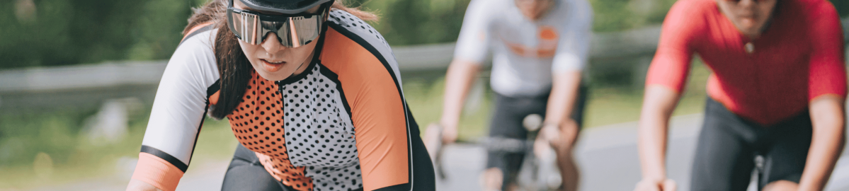 Cyclists Riding Wearing Colorful Jerseys That Were Produced With Nekoosa Dye Sublimation Transfer Paper